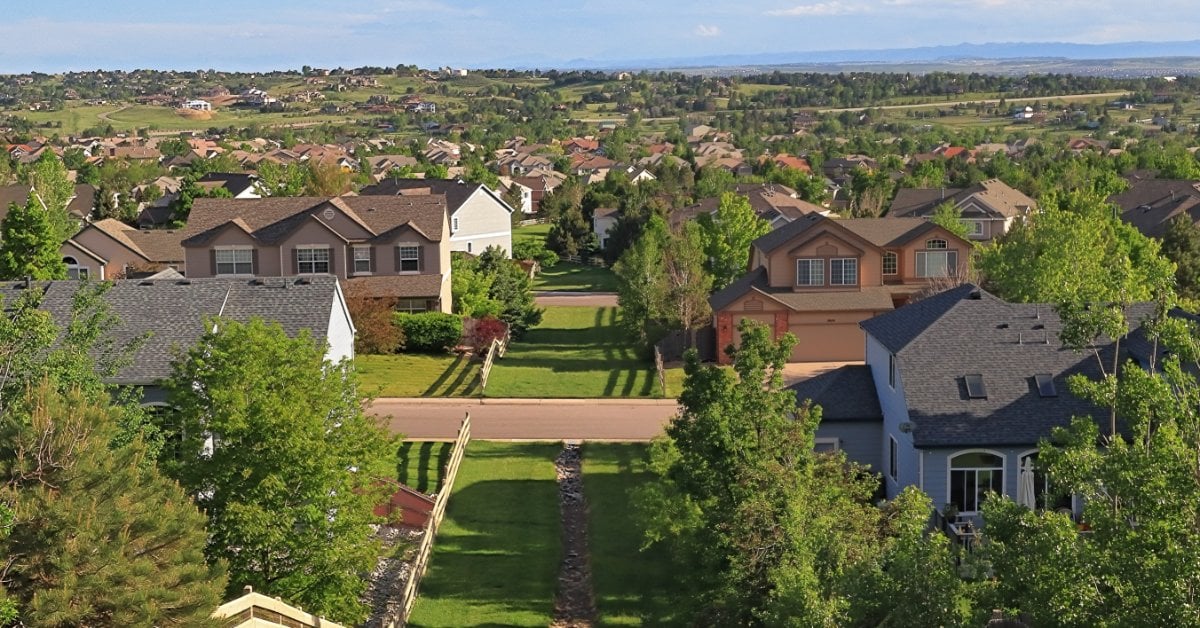 A large suburban neighborhood outside of Denver, Colorado. There are many houses packed close together.